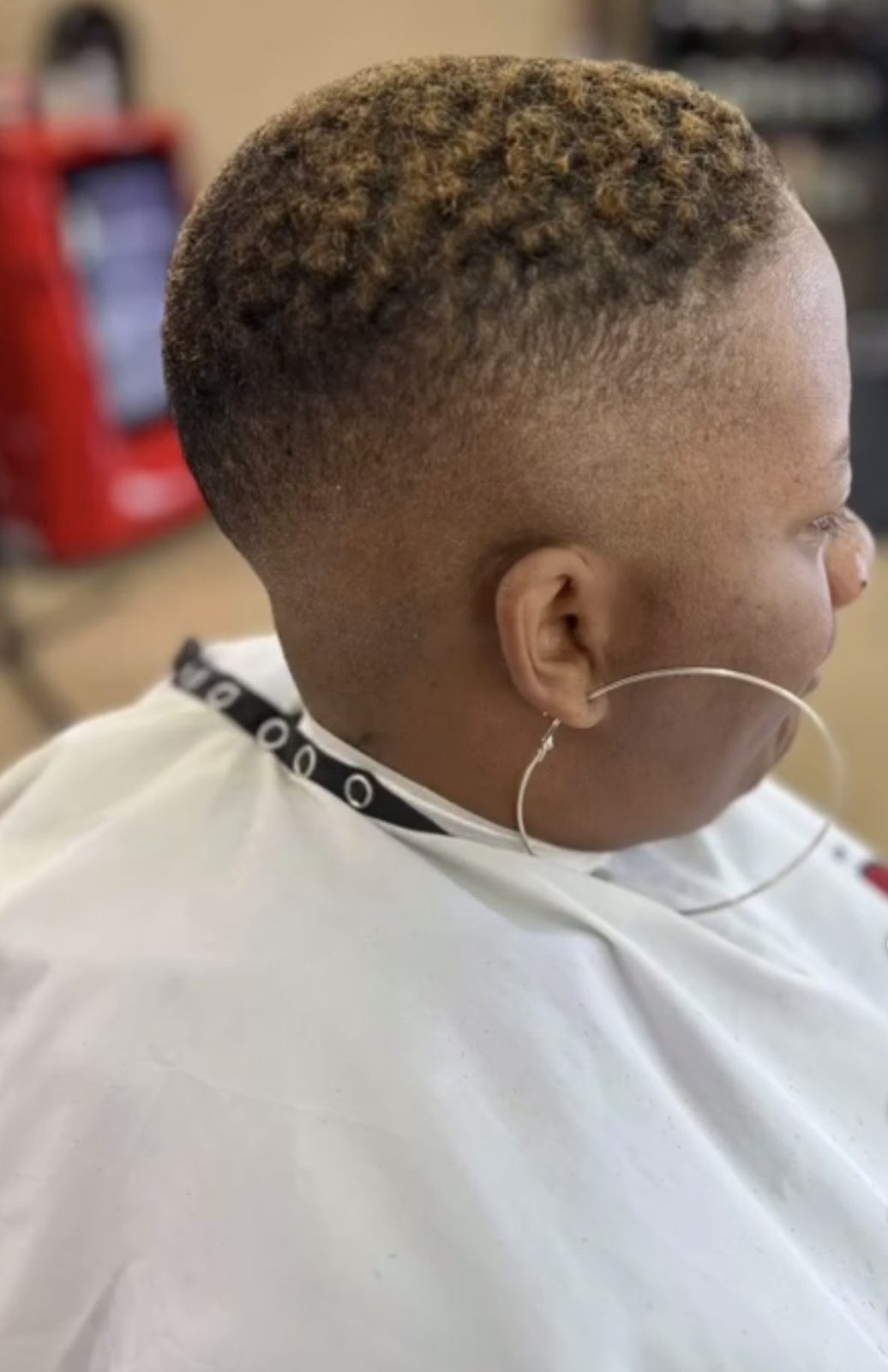 Women's short fade with color by Headlines Barbershop