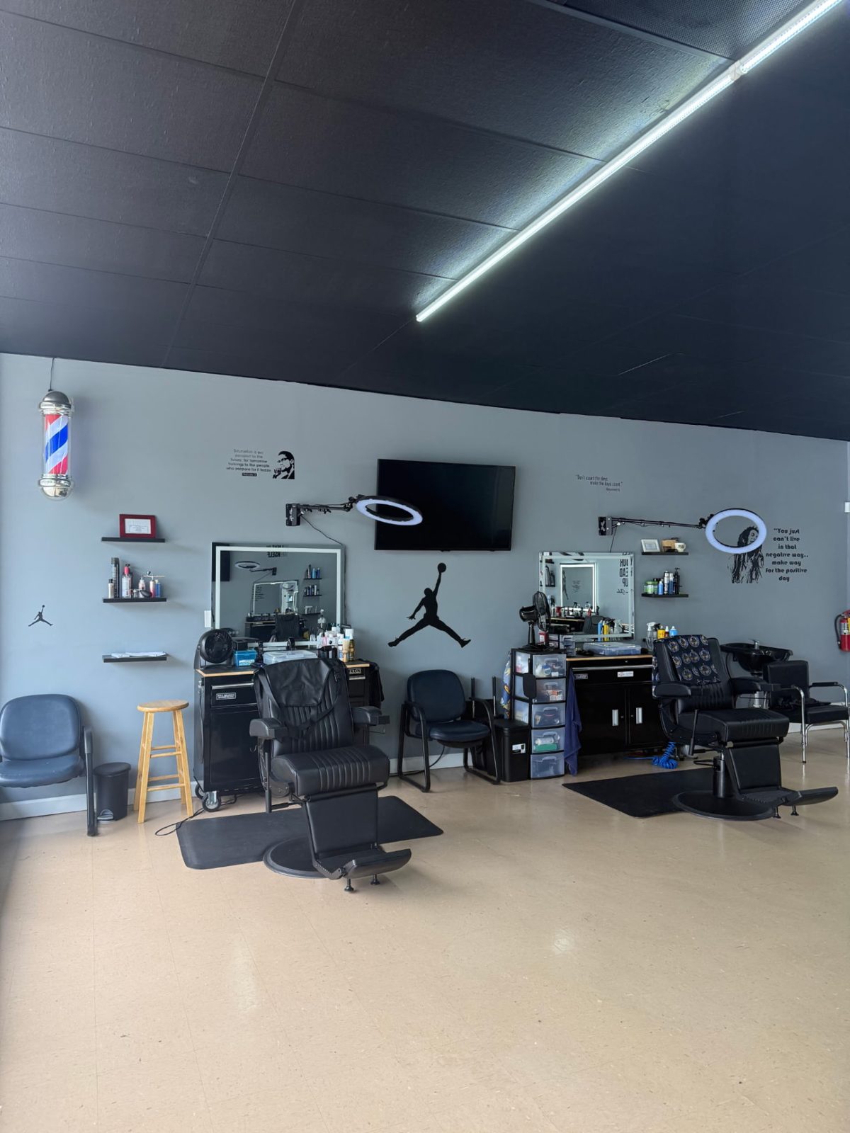 Barber stations and chairs inside Headlines Barbershop